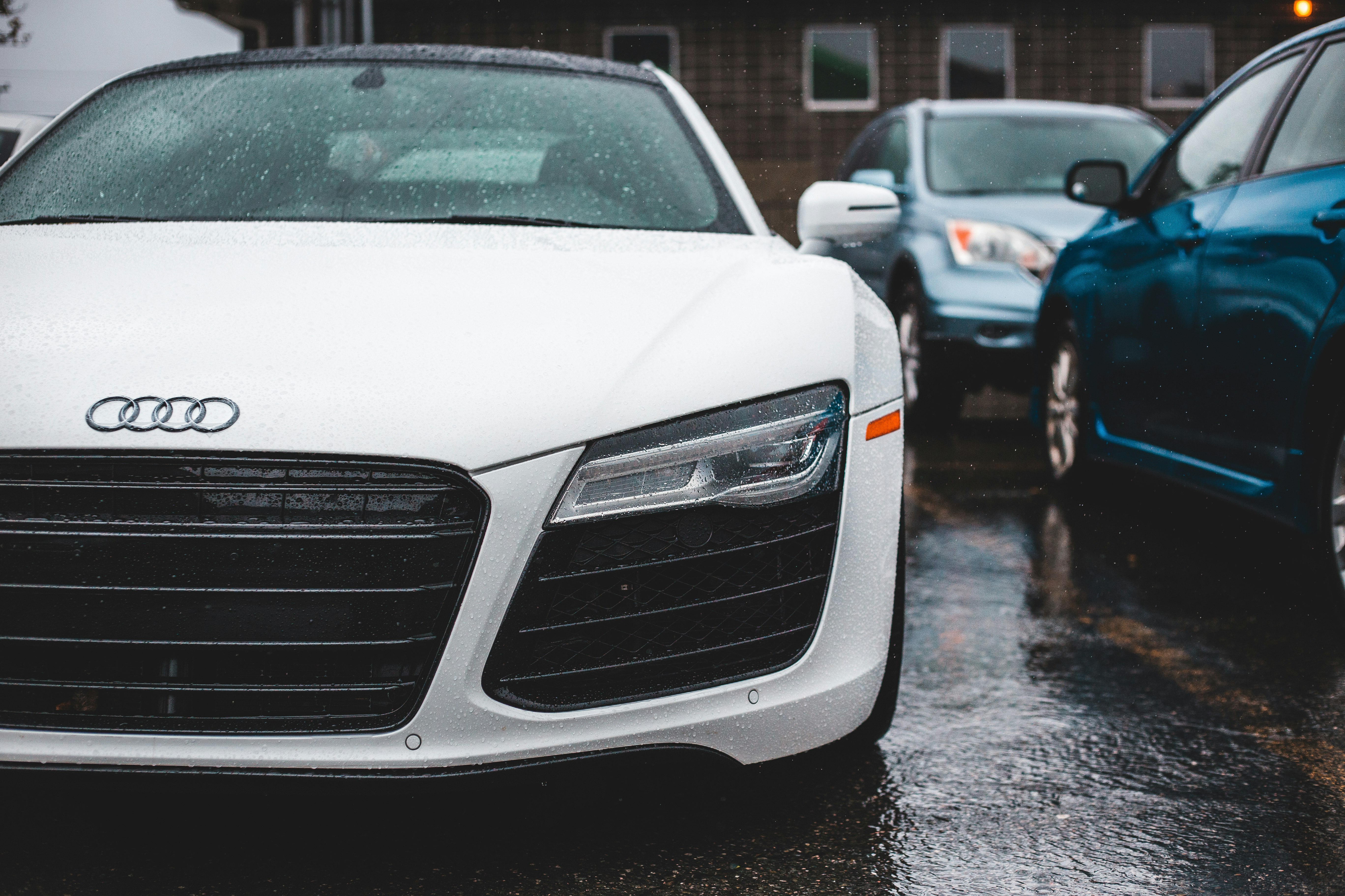 white audi car on road during daytime